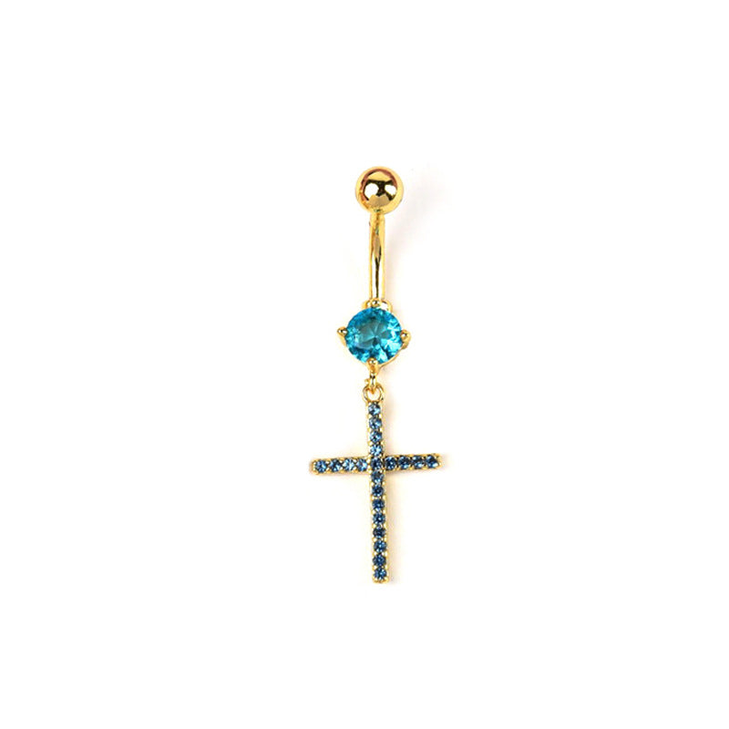 Gold curved barbell belly button ring with a bright blue round crystal and a dangling cross charm paved with navy blue rhinestones