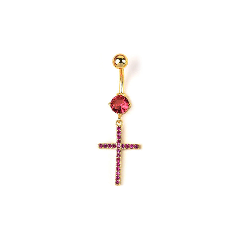 Gold curved barbell belly button piercing featuring a dangling cross pendant pave-set with bright pink crystals