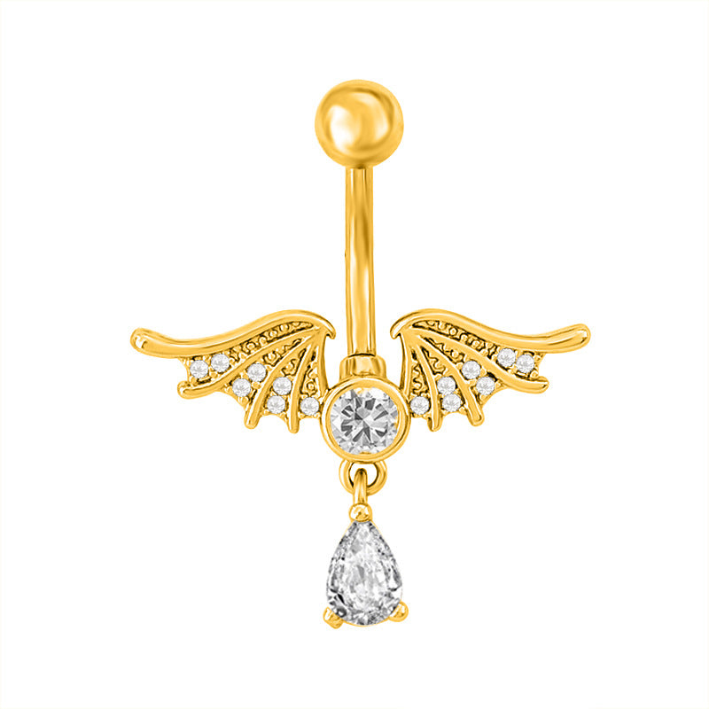 Detailed view of a gold demon or bat wings navel ring with a central sparkling centerpiece and a teardrop dangle.